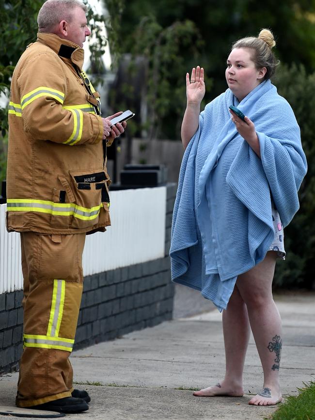 Kahlia McIntosh speaks to a firefighter after the drama. Picture: Nicole Garmston