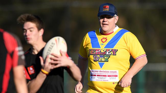 Hang on a minute … you want me to play? Wasn’t there a barbecue to cook somewhere? Photo: AAP