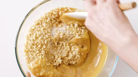 Mix the Rice Bubbles in with melted Caramilk.