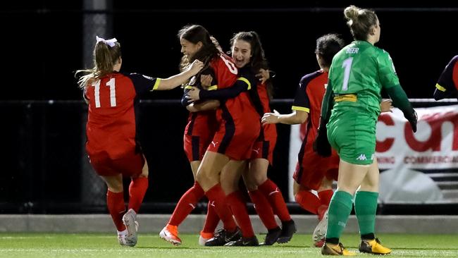 Ella Tonkin and her FFSA National Training Centre teammates celebrate her record-breaking strike. Picture: Adam Butler