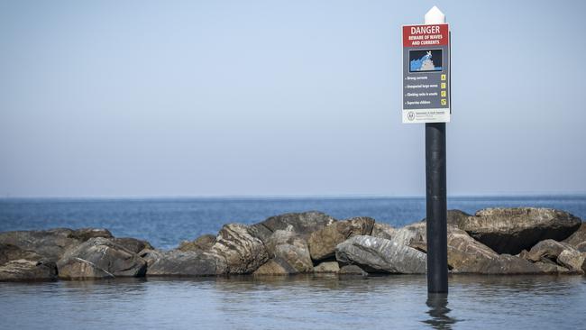 A warning sign near where the girls got into difficulty. Picture: AAP/Mike Burton