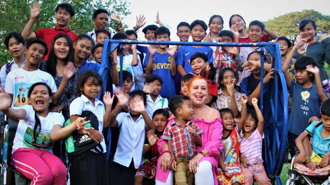 ‘Big Mum’ Geraldine Cox with the children who live in her Sunrise Cambodia home. Her charity operates a home for about 60 children and a day school for some 200.