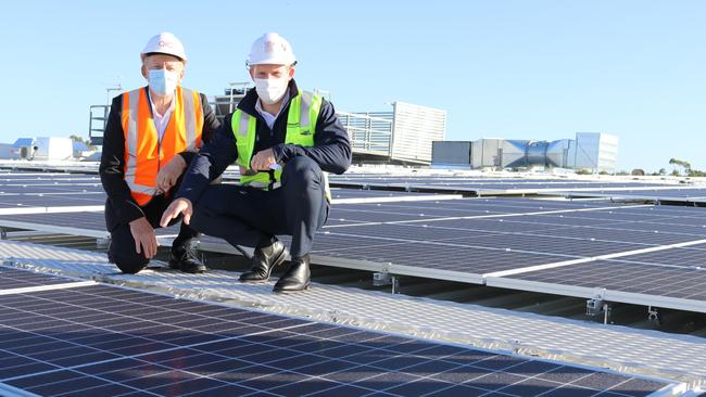 Minister Mick de Brenni and Hyperdome centre manager Brian Turner on the roof.