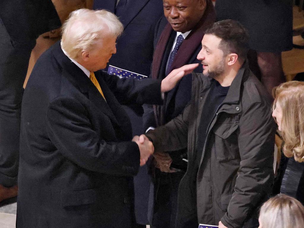 US President-elect Donald Trump shakes hands with Ukraine's President Volodymyr Zelensky. Picture: Ludovic Marin/POOL/AFP