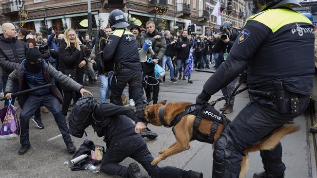 Clashes erupt between anti-riot officers and anti-vaxxers affiliated to far-right parties in Amsterdam, Netherlands. Picture: Pierre Crom/Getty Images