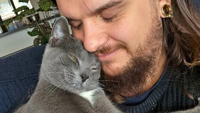 Kian Grainger with his cat, Bonney. Picture: Supplied