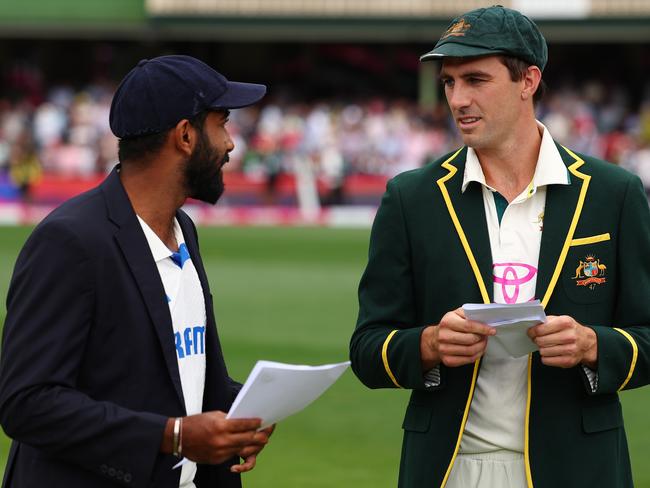 SYDNEY, AUSTRALIA - JANUARY 03: Jasprit Bumrah of India and Pat Cummins of Australia at the coin toss during day one of the Fifth Men's Test Match in the series between Australia and India at Sydney Cricket Ground on January 03, 2025 in Sydney, Australia. (Photo by Morgan Hancock - CA/Cricket Australia via Getty Images)