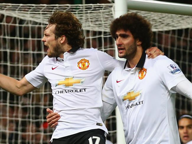 LONDON, ENGLAND - FEBRUARY 08: Daley Blind of Manchester United celebrates scoring their first goal with Marouane Fellaini of Manchester United during the Barclays Premier League match between West Ham United and Manchester United at Boleyn Ground on February 8, 2015 in London, England. (Photo by Clive Rose/Getty Images)