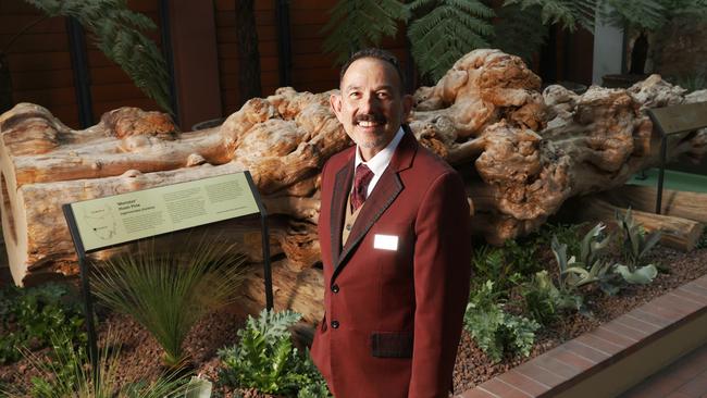 Aaron Cuneo master storyteller at MACq01 and Henry Jones Art Hotel with monster. A giant Huon pine log called 'Monster' is now on display at the atrium at the Henry Jones Art Hotel in Hobart. Picture: Nikki Davis-Jones