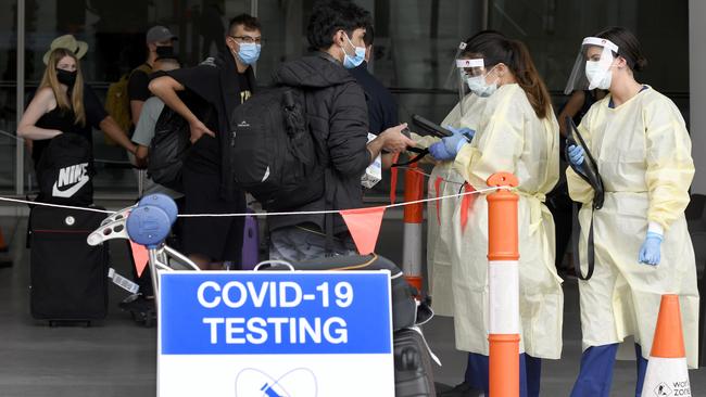 Travellers line up outside Adelaide Airport to get tested for COVID-19. Picture: NCA NewsWire/Naomi Jellicoe