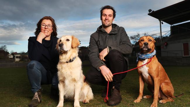 Annalisa Doedens with dog Elsa and Ross Giblin with dog Montgomery. South Hobart locals are picking up other dog users dog poo up off the South Hobart soccer ground in 2021. Picture: Nikki Davis-Jones