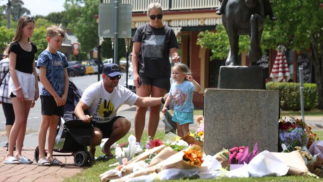Dozens of flower bouquets were laid in tribute in the days after the crash. Picture: NCA NewsWire / Brendan Beckett