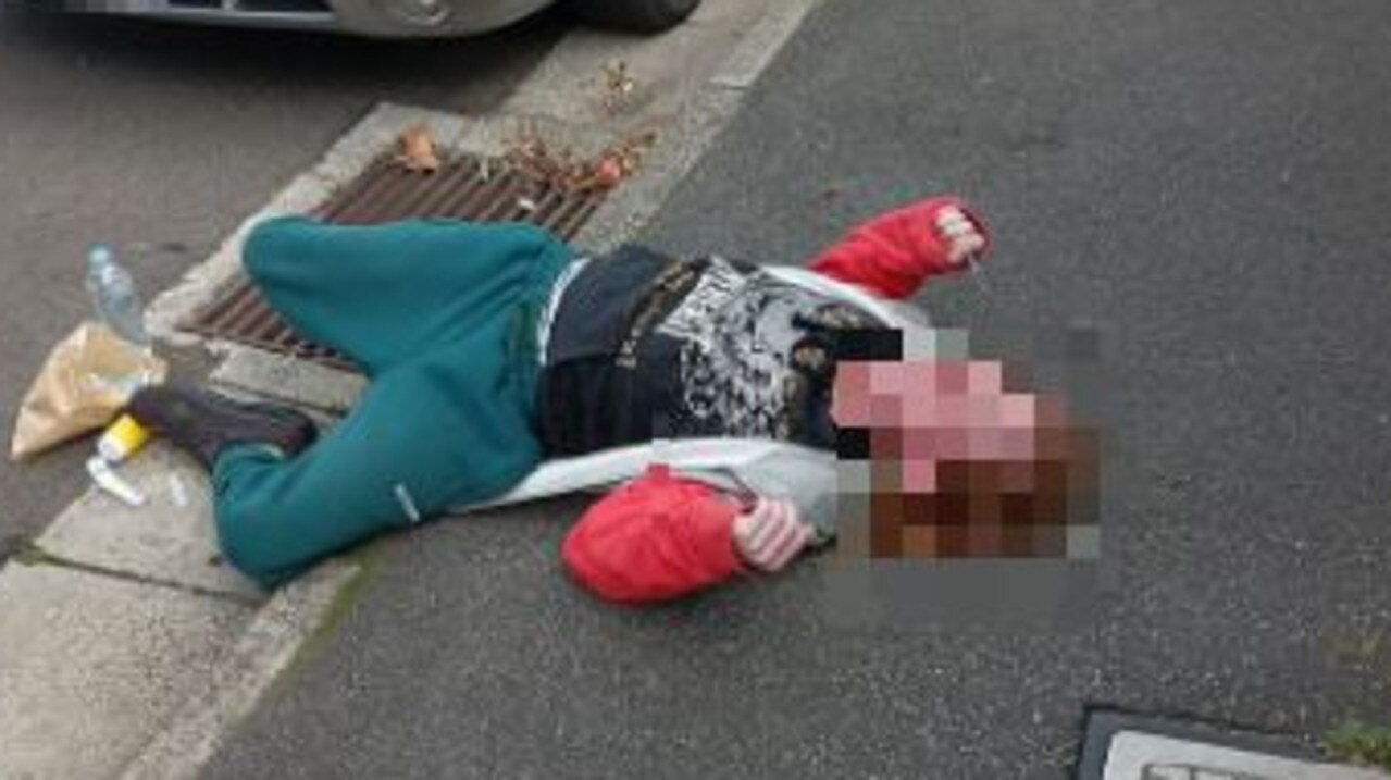 The distressing photo showed a person in the gutter apparently passed out while holding a syringe. Picture: Facebook