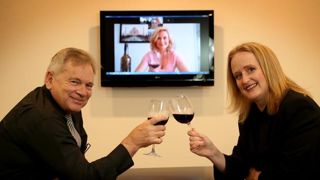 Digital drinks. Greg Paull and Catriona Macleod have a drink with colleague Laura Thurston. Picture: News Corp