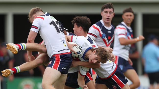 Aidan Wunsch is tackled by Alexander Stephenson in a league game on The Central Coast.