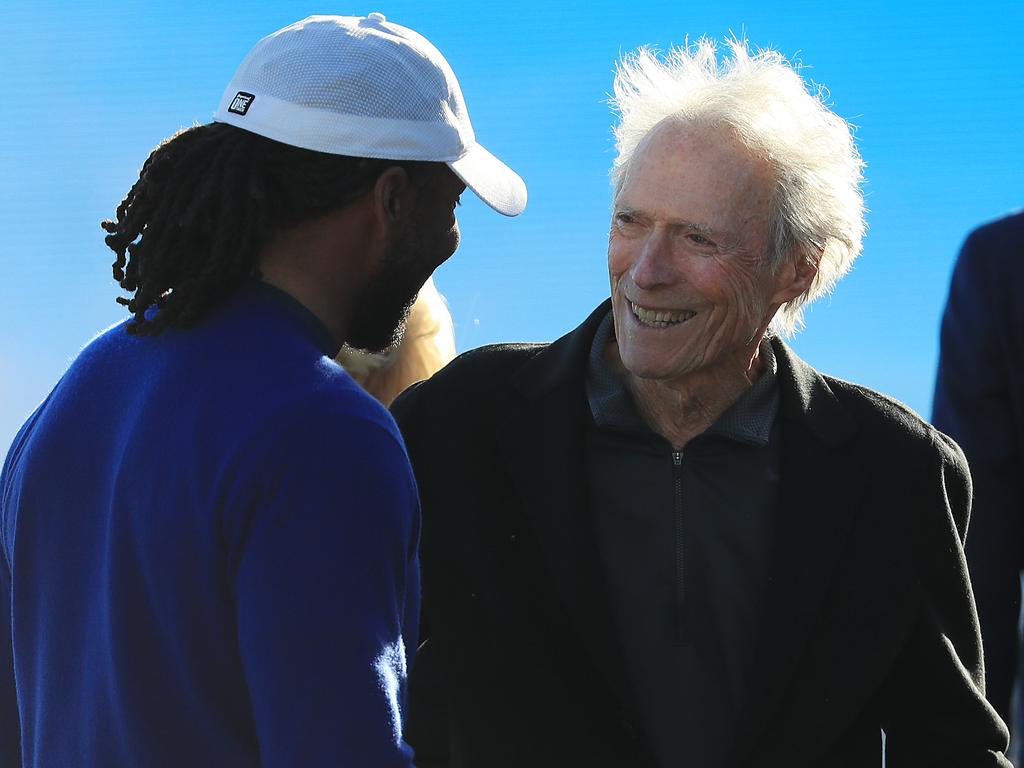 Actor Clint Eastwood talks with Larry Fitzgerald of the Arizona Cardinals after the final round of the AT&amp;T Pebble Beach Pro-Am at Pebble Beach Golf Links in Pebble Beach, California. Picture: Getty Images