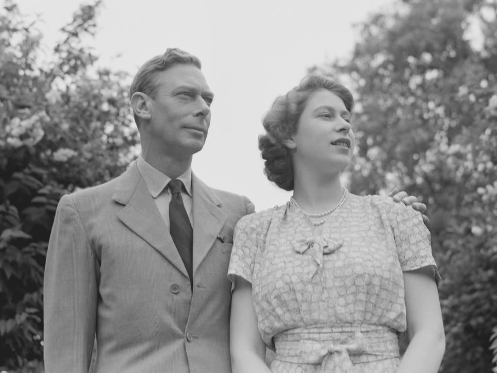 The Queen with her father, King George VI in the gardens at Windsor Castle. Picture: Getty