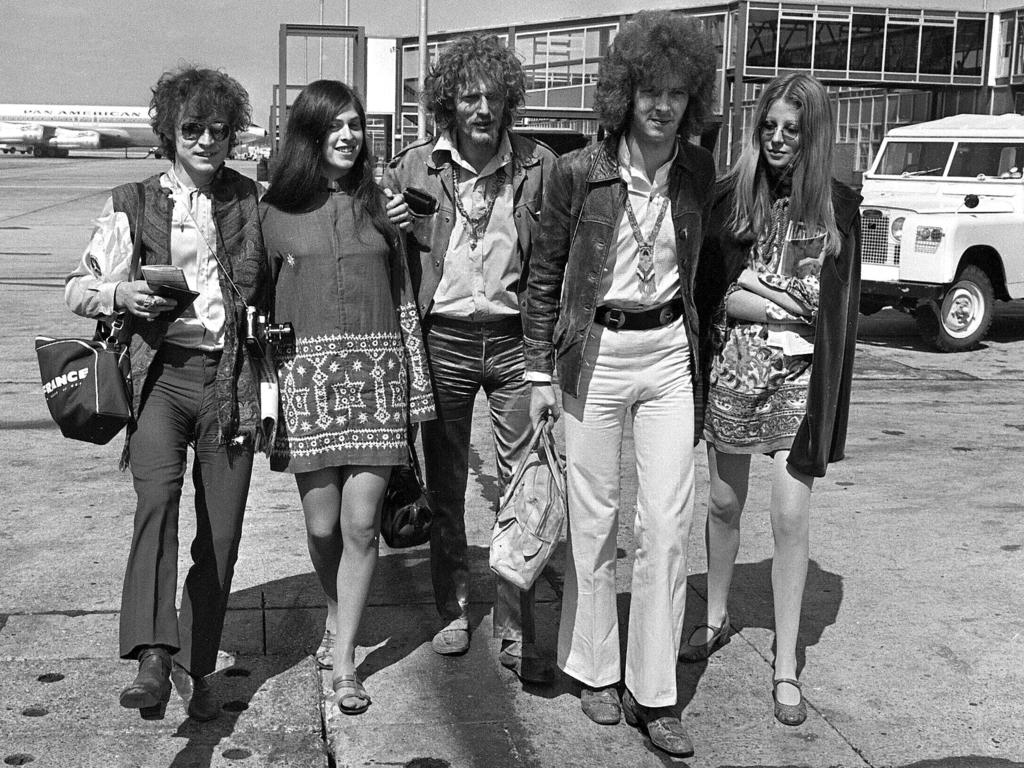 Cream depart from Heathrow Airport in London, for their American tour in 1967. The trio, walking with unidentified female companions, from left are, base guitarist Jack Bruce, drummer Ginger Baker, and lead guitarist Eric Clapton. Picture: AP