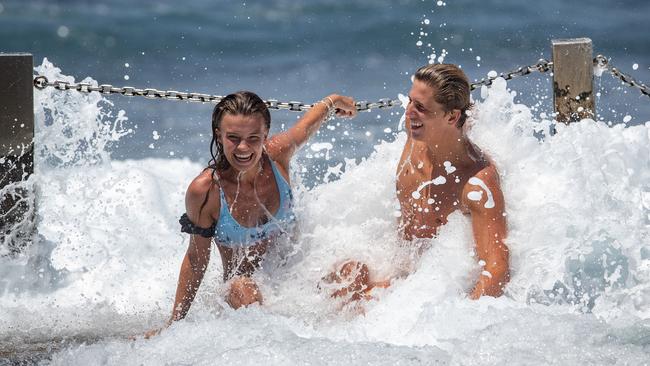 Lauren Hufnagl and her friend Guy Rowles took some time out for a quick dip at Mahoon Pool in Maroubra. Picture: Julian Andrews