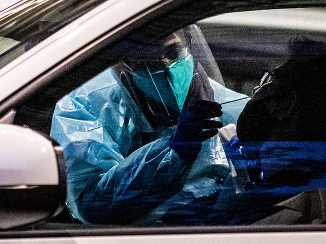 SYDNEY, AUSTRALIA - NewsWire Photos July 18, 2021: Covid testing and cars lined up at Fairfield covid drive through clinic. Picture: NCA NewsWire / Flavio Brancaleone