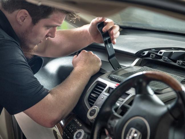 Technicians work to replace faulty Takata airbags.