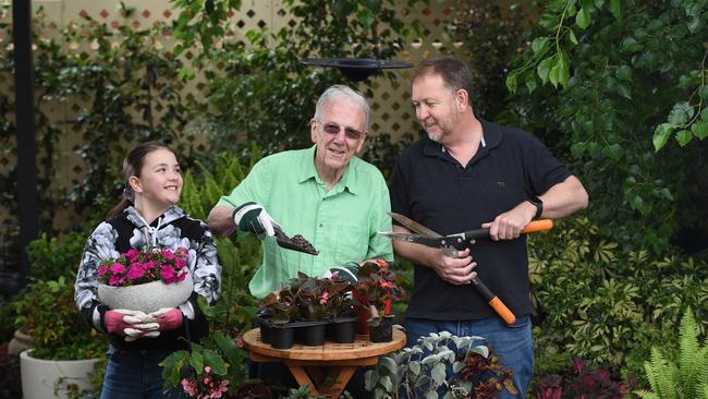 Gardening writer Jon Lamb at home with granddaughter Scarlett and son Andrew. Picture: Naomi Jellicoe