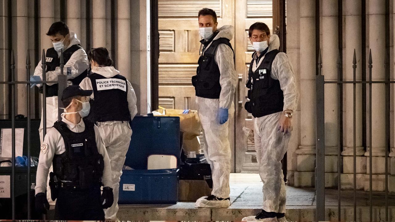 Forensic officers work at night in front of Notre Dame Basilica on October 29, 2020 in Nice where a man armed with a knife fatally attacked three people in the church. Picture: Arnold Jerocki/Getty Images.