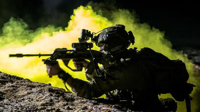 An Australian Army soldier fires at the enemy during a night contact as part of Exercise Hamel 2018 ... the Australian Army’s largest annual exercise has been cancelled for this year