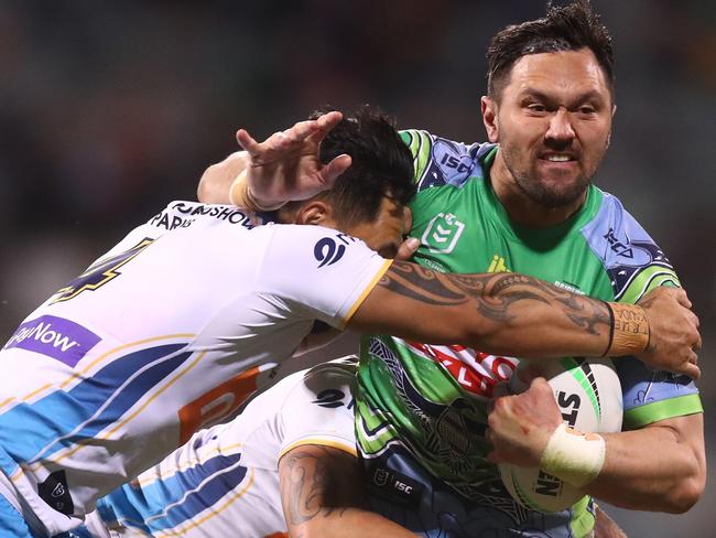 CANBERRA, AUSTRALIA - JULY 03: Jordan Rapana of the Raiders is tackled during the round 16 NRL match between the Canberra Raiders and the Gold Coast Titans at GIO Stadium, on July 03, 2021, in Canberra, Australia. (Photo by Mike Owen/Getty Images)