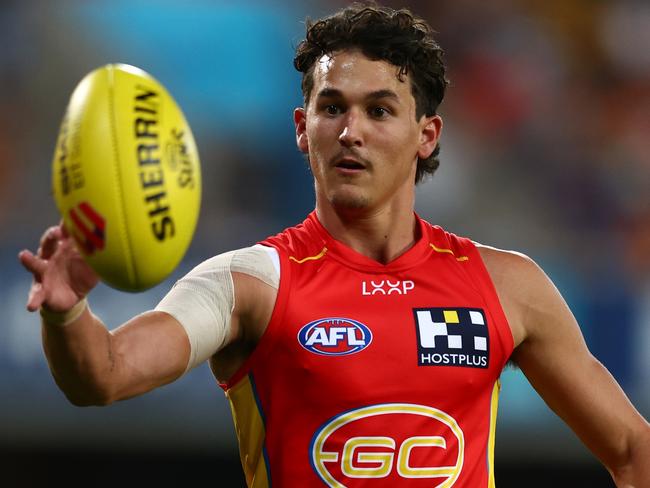 GOLD COAST, AUSTRALIA - APRIL 13: Wil Powell of the Suns warms up during the round five AFL match between Gold Coast Suns and Hawthorn Hawks at People First Stadium, on April 13, 2024, in Gold Coast, Australia. (Photo by Chris Hyde/Getty Images)