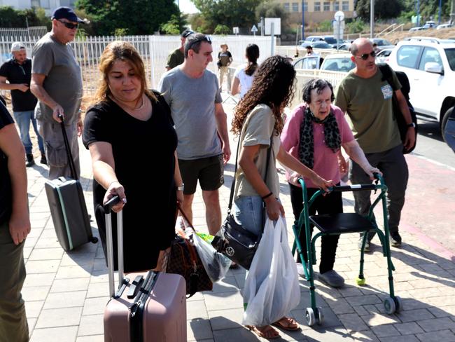 Israelis wait to board a bus as they evacuate from the southern Israeli city of Sderot to safer areas in the state of Israel. Picture: Jack Guez/AFP