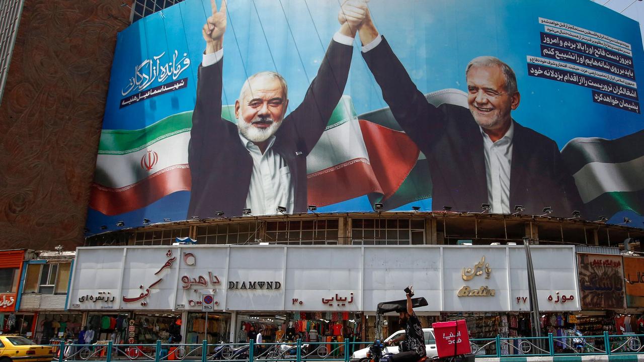 A huge billboard of Iranian President Masoud Pezeshkian (R) and slain Hamas leader Ismail Haniyeh in Tehran, Iran. Picture: AFP