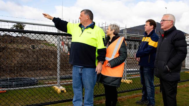 Adrian Granger from Kelly Civil Contracting with Mayor of Glenorchy Sue Hickey, Metro club president Simon Land, and Federal member for Clark Andrew Wilkie surveying the works at Metro soccer club in Chigwell where building supplies have been stolen. Picture: Linda Higginson