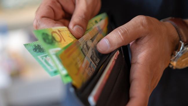 a male taking money out of the valet.  Picture: istock