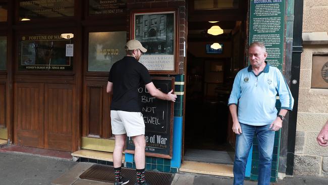 23/3/20: Sam Vojsk looks on the doors are closed on The Fortune of War, Sydney's oldest pub at The Rocks. Picture: John Feder/The Australian.