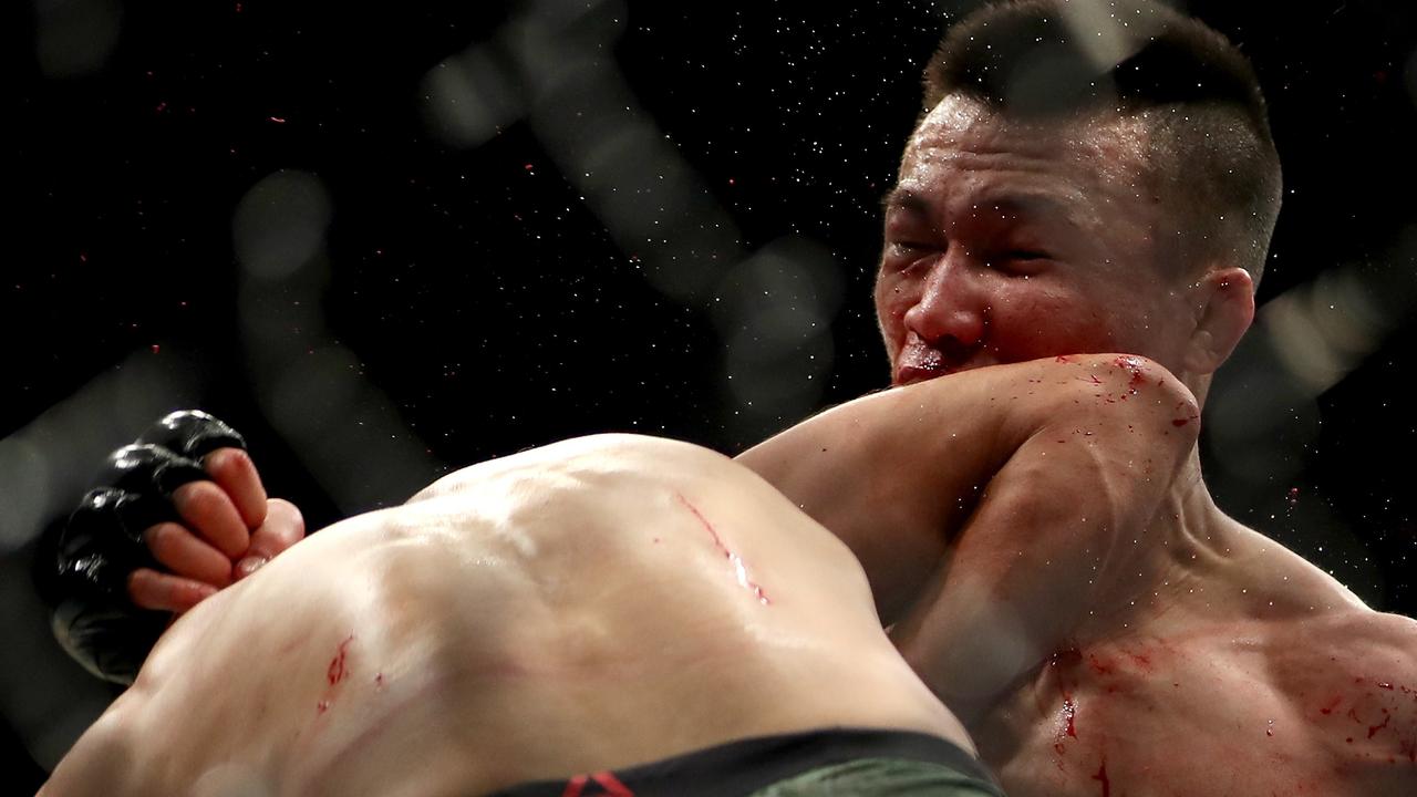 Chan Sung Jung is knocked out by an elbow from Yair Rodriguez in the final second of their UFC fight. Photo: Matthew Stockman/Getty Images/AFP