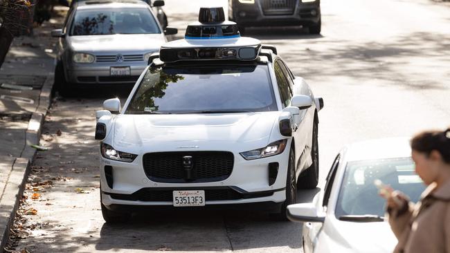 (FILES) A Waymo autonomous vehicle on Steiner Street in San Francisco, on November 17, 2023. The National Highway Traffic Safety Administration (NHTSA) on May 14, 2024, said it had opened an investigation into Google-owned Waymo after reports of 22 incidents with its self-driving technology. The preliminary probe into the robotaxi company will cover the firm's 444 vehicles, according to documents posted on the agency's website. (Photo by Jason Henry / AFP)