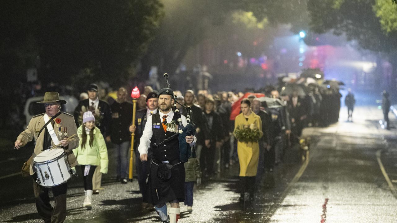 The pre-dawn march to the Anzac Day Toowoomba Dawn Service, Tuesday, April 25, 2023. Picture: Kevin Farmer