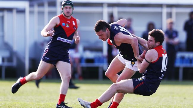 North Hobart's Jayden Charlton tackles Launceston's Casey Brown. Picture: Zak Simmonds