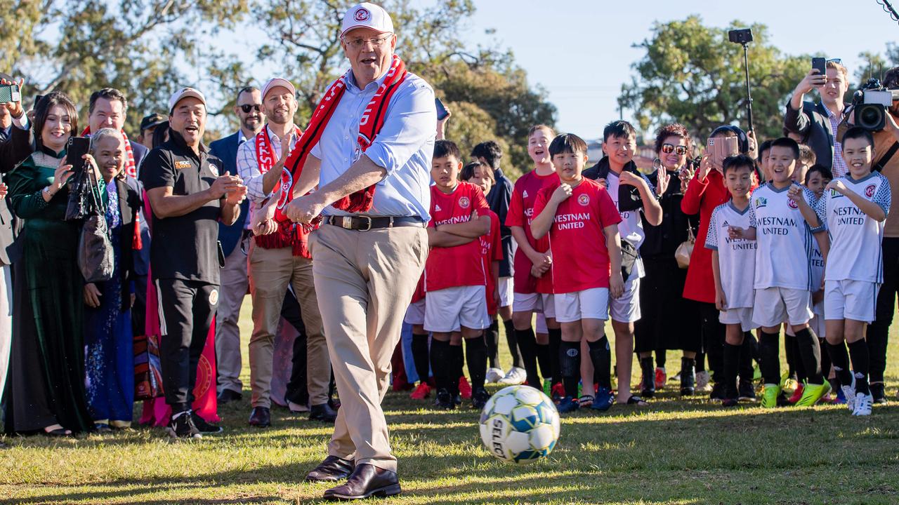 Scott Morrison tests his soccer skill campaigning in the seat of Cowan in Western Australia on Saturday. Picture: Jason Edwards