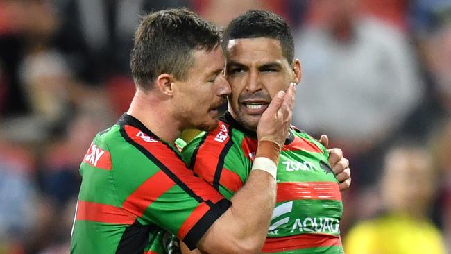 Cody Walker is congratulated by Rabbitohs teammate Damien Cook after scoring a try. Picture: AAP