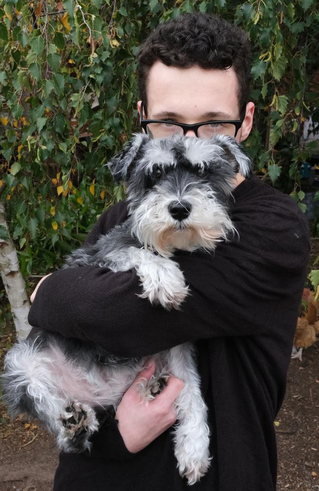 Oliver holding Daisy the miniature Schnauzer. Picture: Mark Wilson