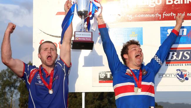 South Croydon coach Leigh Adams (L) and captain Daniel King celebrate with the trophy. Picture: Hamish Blair