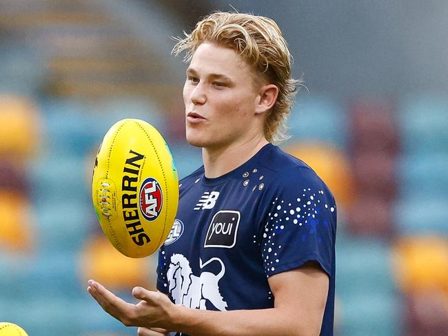 BRISBANE, AUSTRALIA - MARCH 29: Levi Ashcroft of the Lions and Chris Fagan, Senior Coach of the Lions are seen prior to the 2025 AFL Round 03 match between the Brisbane Lions and the Geelong Cats at The Gabba on March 29, 2025 in Brisbane, Australia. (Photo by Russell Freeman/AFL Photos via Getty Images)