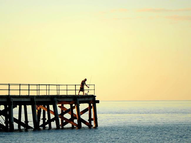 Fishing from the jetty at Second Valley beach, South Australia.  Picture: BERNARD HUMPHREYS