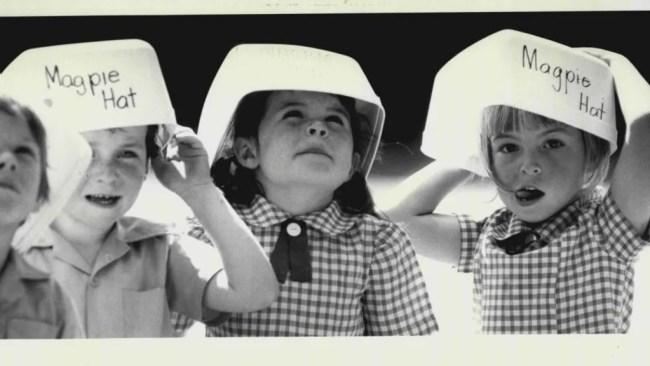 Kids at a school in Newcastle, NSW, with their magpie hats in 1984. Picture: Getty