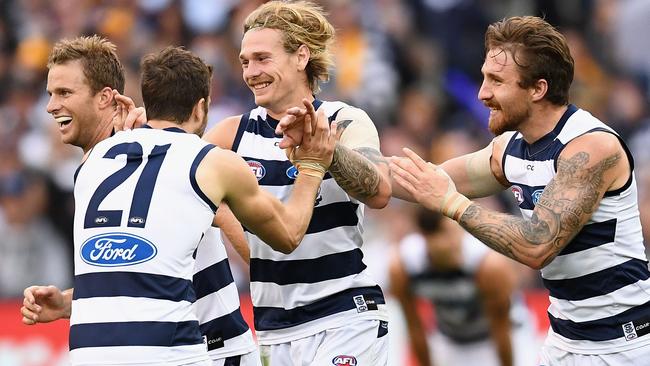 Geelong players celebrate Tom Stewart’s first goal in AFL football. Picture: Getty Images