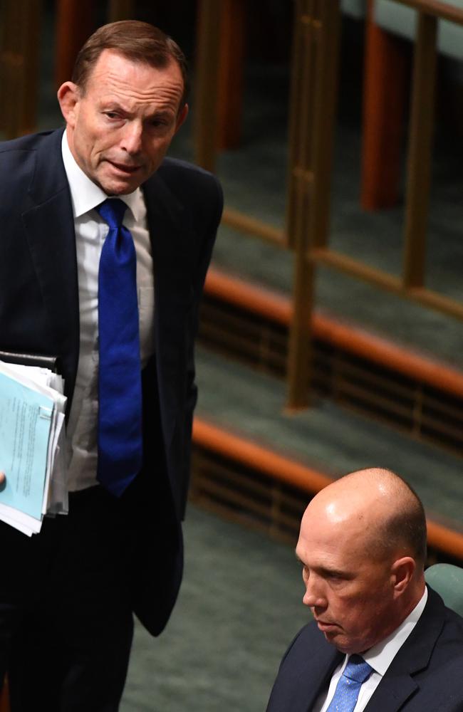 Former prime minister Tony Abbott and former minister for Home Affairs Peter Dutton chat during Question Time in the House of Representatives on August 22. Picture: AAP