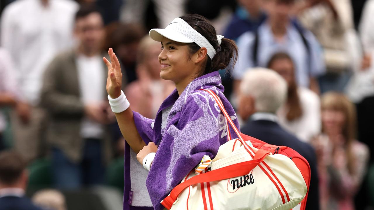 Emma Raducanu of Great Britain acknowledges the crowd as she leaves Centre Court following her defeat. (Photo by Clive Brunskill/Getty Images)