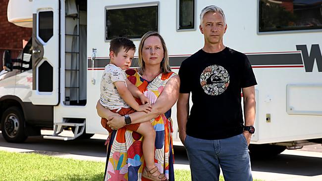 Lyrian and Steven Fleming-Parsley, with three-year-old son Joachim, cannot return to Melbourne from Sydney. Picture: Jane Dempster